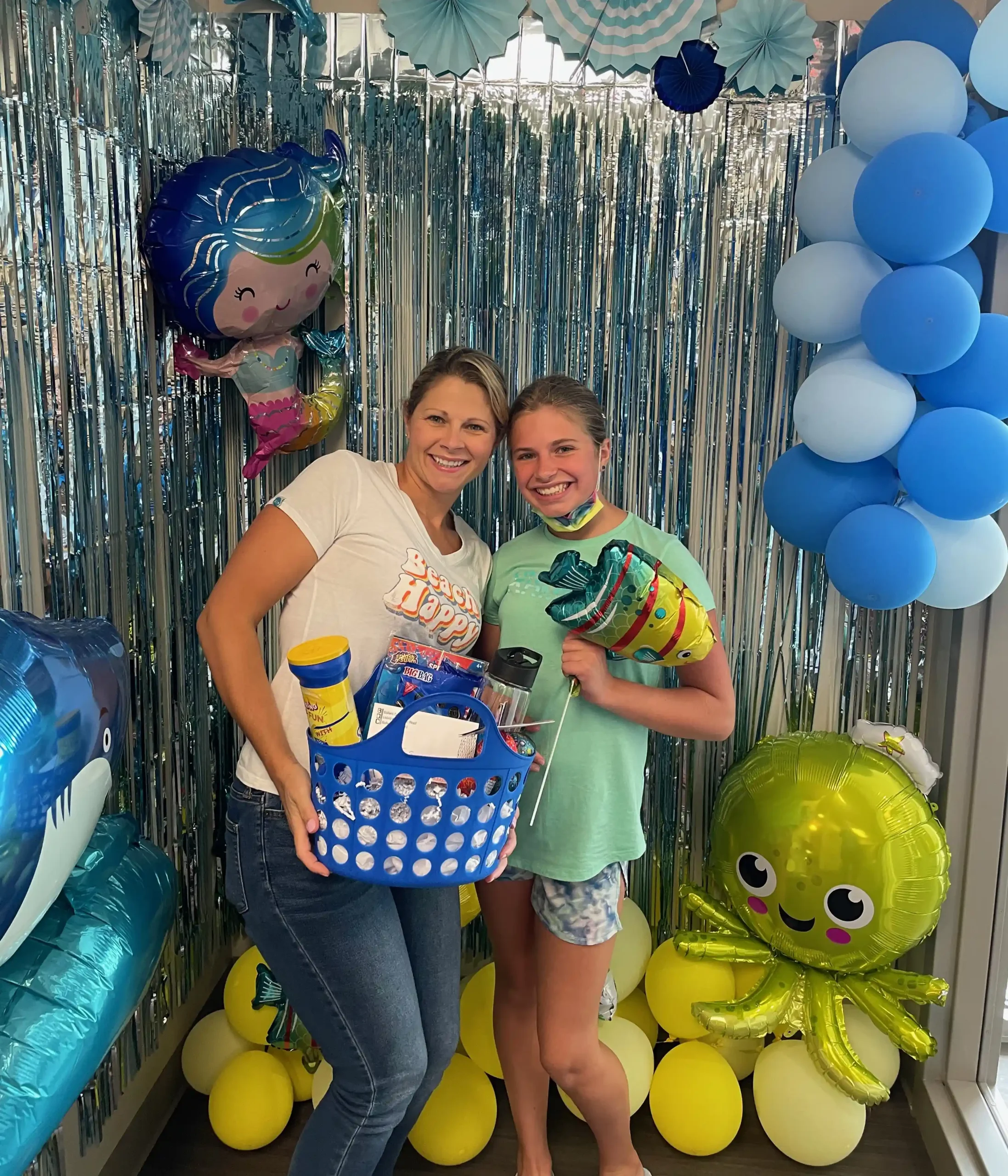 2 Patients Smiling on special day and holding a gift basket